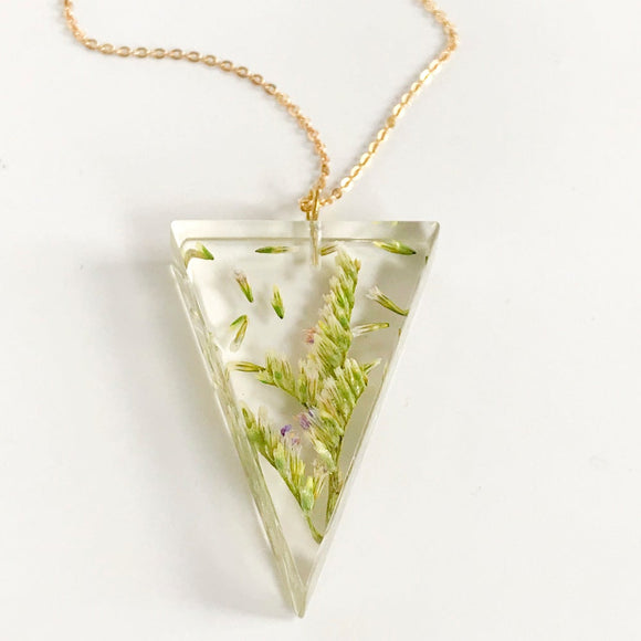 ECO-RESIN Triangle pendant with flower accents.