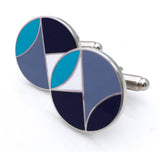 Round cufflinks with navy, blue, and white geometric design.