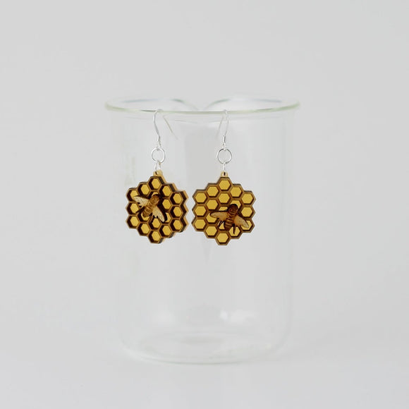 Medium wood and acrylic honeycomb bee earrings.
