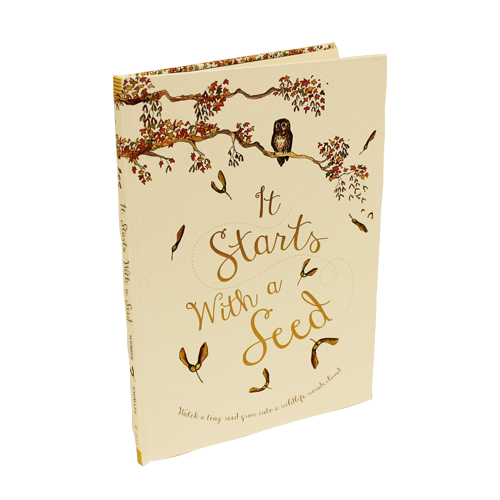 White hardcover book with seedlings.