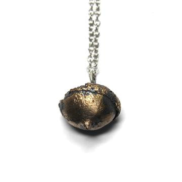 Acorn necklace casted in solid bronze antique finish on rhodium chain with lobster clasp.  